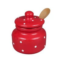 Piros pöttyös mézescsupor kanállal 